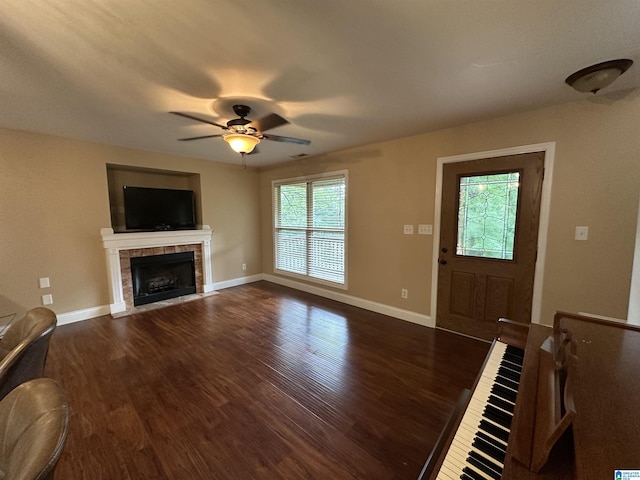 21131 Delmar Dr, Lake View, AL 35111 - unfurnished living room with dark wood finished floors, a tile fireplace, and a ceiling fan