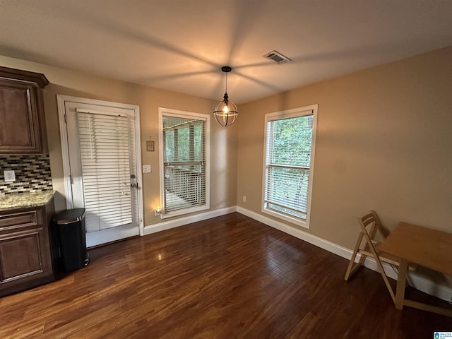 21131 Delmar Dr, Lake View, AL 35111 - unfurnished dining area with baseboards and dark wood-style floors