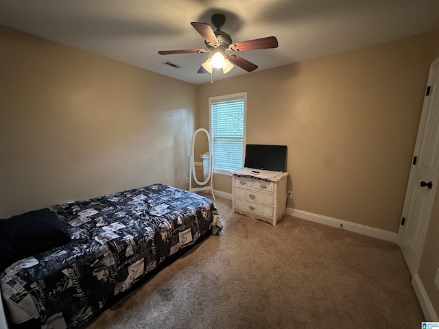 21131 Delmar Dr, Lake View, AL 35111 - bedroom with light colored carpet and ceiling fan