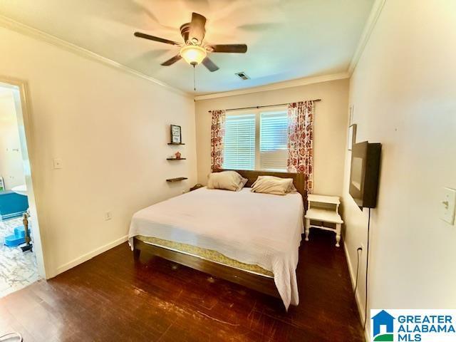 1005 4th Ave N, Clanton, AL 35045 - bedroom with crown molding, wood finished floors, a ceiling fan, and baseboards