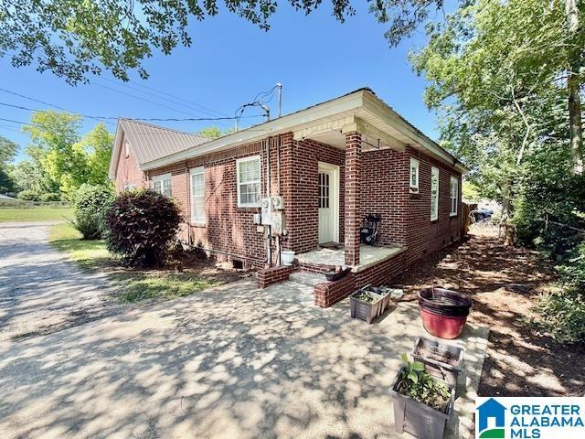 1005 4th Ave N, Clanton, AL 35045 - view of home's exterior with brick siding