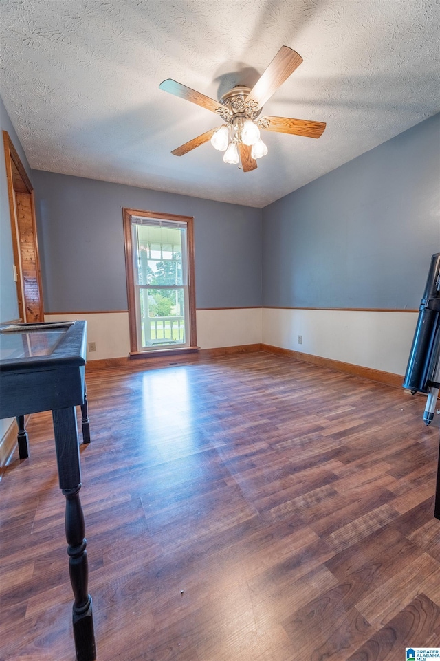 1709 Round Hill Rd, Weaver, AL 36277 - recreation room with wood finished floors, baseboards, a ceiling fan, and a textured ceiling