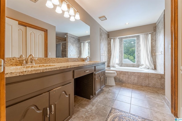 1709 Round Hill Rd, Weaver, AL 36277 - bathroom with double vanity, tiled bath, tiled shower, tile patterned flooring, and toilet