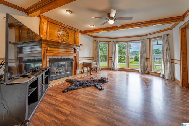 1709 Round Hill Rd, Weaver, AL 36277 - living room featuring ornamental molding, a tile fireplace, ceiling fan, wood finished floors, and beamed ceiling