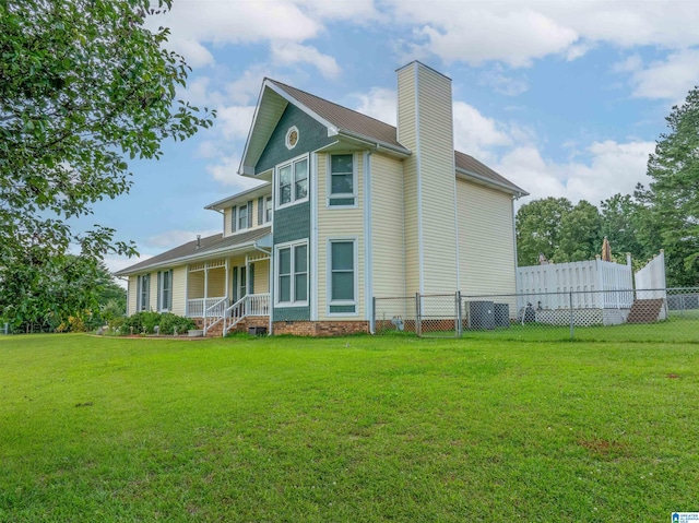 1709 Round Hill Rd, Weaver, AL 36277 - view of front facade featuring covered porch, a chimney, and central AC unit