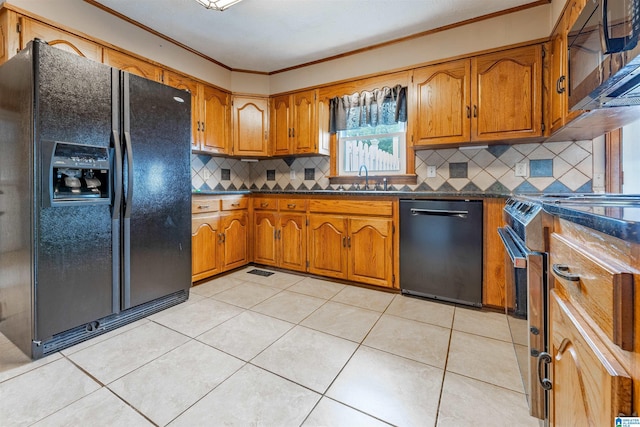 1709 Round Hill Rd, Weaver, AL 36277 - kitchen with black appliances, dark countertops, brown cabinets, ornamental molding, and backsplash
