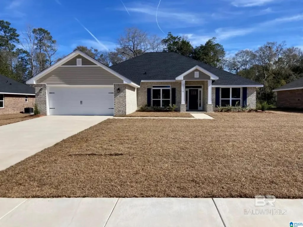 744 Jamestown Cir, Montevallo, AL 35115 - view of front of home featuring brick siding, a garage, and concrete driveway