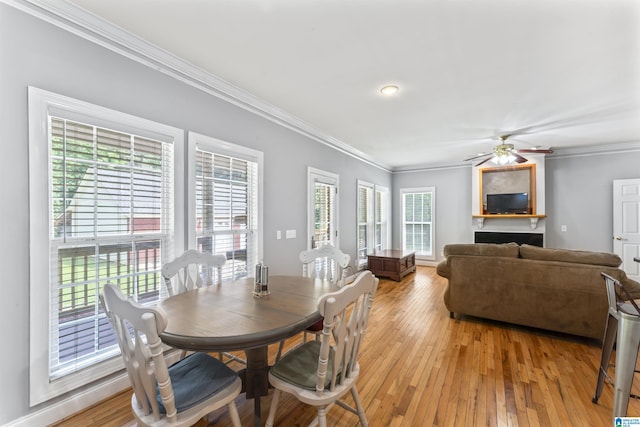 691 Reid Dr, Trafford, AL 35172 - dining space featuring ornamental molding, light wood-style flooring, and ceiling fan