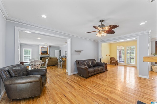691 Reid Dr, Trafford, AL 35172 - living area with a ceiling fan, light wood finished floors, crown molding, baseboards, and recessed lighting