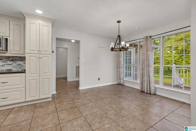 159 Williams Rd, Cullman, AL 35057 - unfurnished dining area featuring a chandelier, baseboards, light tile patterned flooring, and recessed lighting