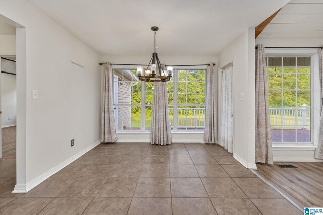159 Williams Rd, Cullman, AL 35057 - unfurnished dining area featuring healthy amount of natural light, a chandelier, and baseboards
