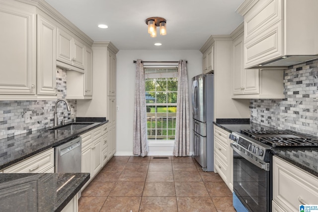159 Williams Rd, Cullman, AL 35057 - kitchen featuring stainless steel appliances, a sink, premium range hood, decorative backsplash, and recessed lighting