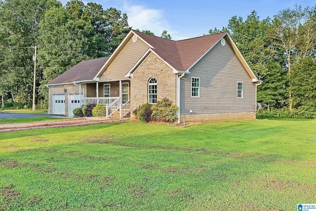 159 Williams Rd, Cullman, AL 35057 - view of front of property featuring a garage, a front yard, driveway, a porch, and brick siding