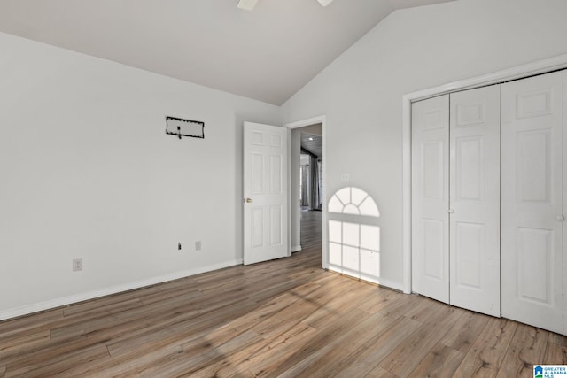 159 Williams Rd, Cullman, AL 35057 - unfurnished bedroom with light wood-style floors, vaulted ceiling, a closet, a ceiling fan, and baseboards