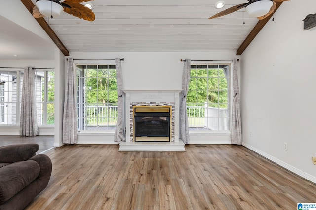 159 Williams Rd, Cullman, AL 35057 - living area featuring a ceiling fan, plenty of natural light, a glass covered fireplace, wood finished floors, and wood ceiling