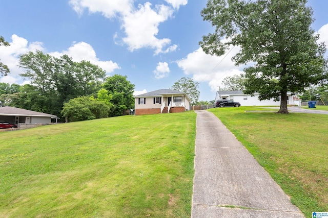4507 Charles Ave, Anniston, AL 36206 - view of front of property featuring driveway and a front lawn