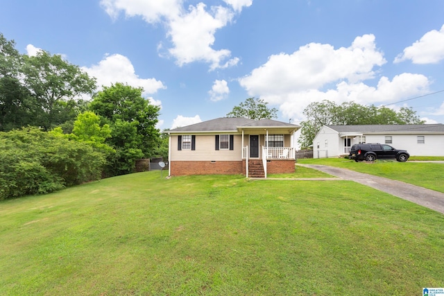 4507 Charles Ave, Anniston, AL 36206 - view of front of house featuring concrete driveway, a front yard, and covered porch