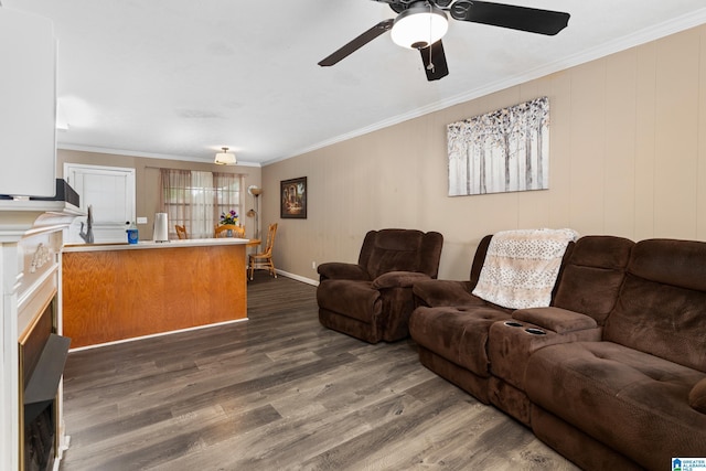 4507 Charles Ave, Anniston, AL 36206 - living area featuring wood finished floors, ornamental molding, ceiling fan, and baseboards
