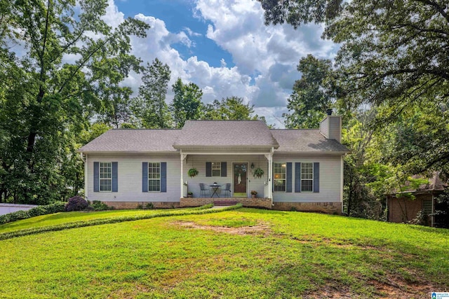 5883 William O Ln, Gardendale, AL 35071 - view of front of home featuring a porch, a chimney, a front yard, and crawl space