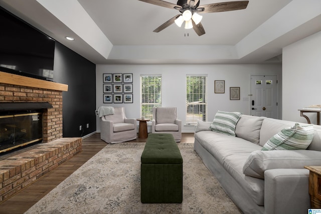 5883 William O Ln, Gardendale, AL 35071 - living room with ceiling fan, a raised ceiling, a fireplace, wood finished floors, and recessed lighting