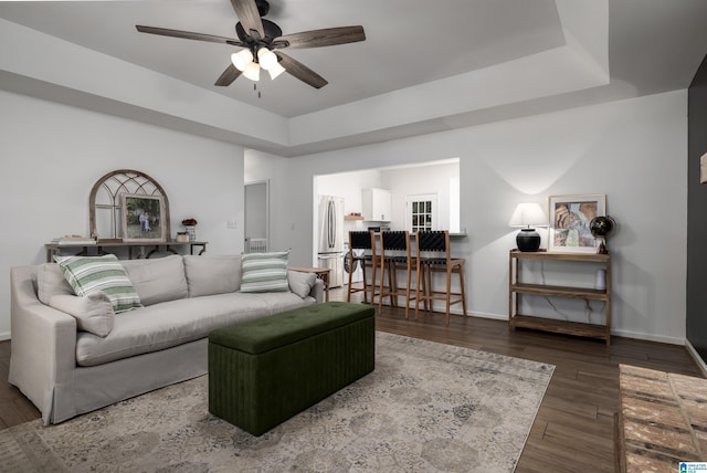5883 William O Ln, Gardendale, AL 35071 - living room with a ceiling fan, wood finished floors, a tray ceiling, and baseboards