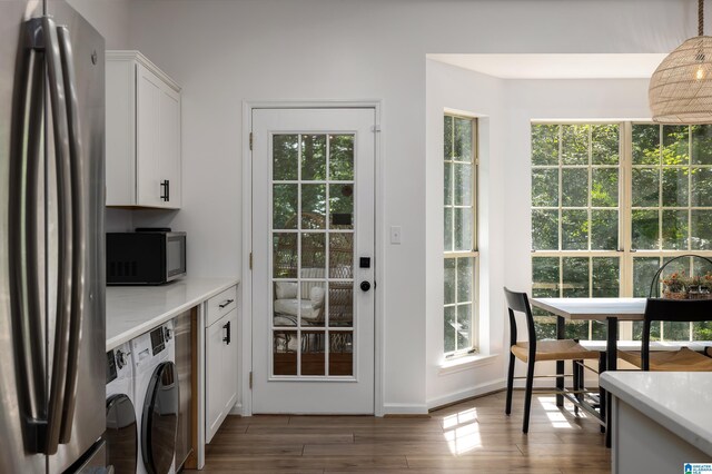 5883 William O Ln, Gardendale, AL 35071 - laundry room with washer / clothes dryer, dark wood-style floors, healthy amount of natural light, and baseboards