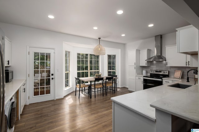 5883 William O Ln, Gardendale, AL 35071 - kitchen with stainless steel range with electric stovetop, wall chimney exhaust hood, a sink, light stone countertops, and white cabinets