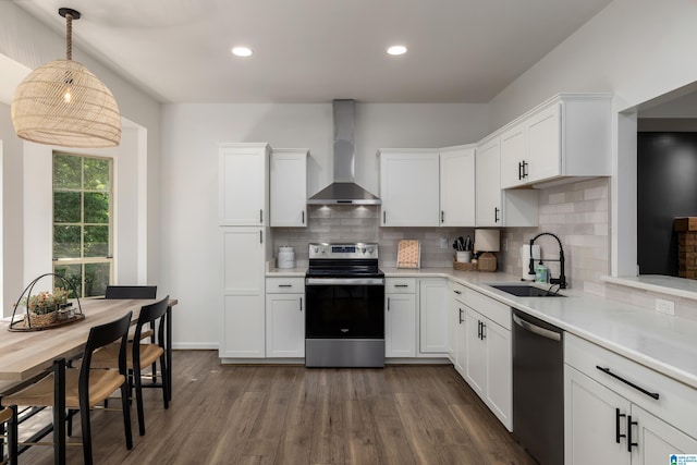 5883 William O Ln, Gardendale, AL 35071 - kitchen featuring stainless steel appliances, wall chimney exhaust hood, a sink, light countertops, and recessed lighting