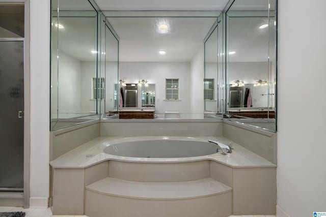 5883 William O Ln, Gardendale, AL 35071 - bathroom featuring a bath and a stall shower