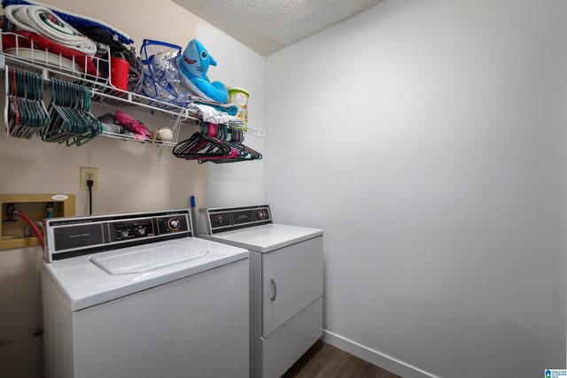 5883 William O Ln, Gardendale, AL 35071 - laundry area featuring washing machine and clothes dryer, dark wood finished floors, a textured ceiling, and baseboards