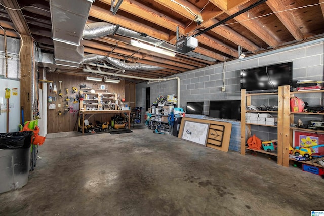 5883 William O Ln, Gardendale, AL 35071 - basement featuring a workshop area, concrete block wall, and gas water heater