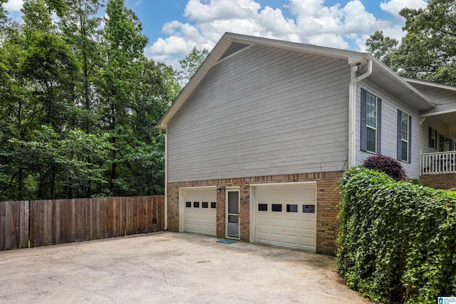 5883 William O Ln, Gardendale, AL 35071 - view of property exterior featuring an attached garage, brick siding, and driveway