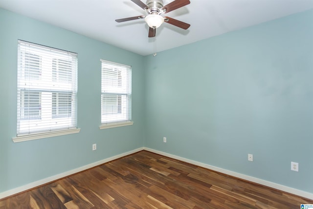 401 20th St S Unit 322, Birmingham, AL 35233 - spare room featuring dark wood finished floors, baseboards, and a ceiling fan