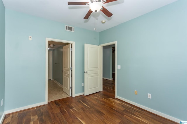 401 20th St S Unit 322, Birmingham, AL 35233 - unfurnished bedroom with wood finished floors, baseboards, and a ceiling fan