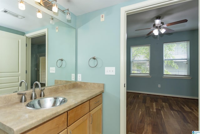 401 20th St S Unit 322, Birmingham, AL 35233 - bathroom featuring wood finished floors, a ceiling fan, vanity, and baseboards