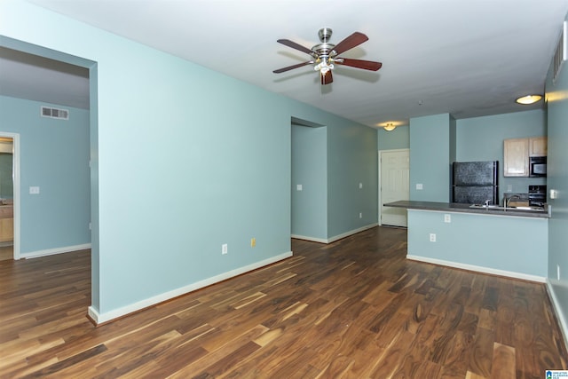 401 20th St S Unit 322, Birmingham, AL 35233 - kitchen with black appliances, a ceiling fan, dark wood-type flooring, baseboards, and dark countertops