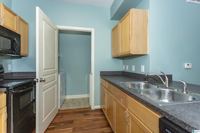 401 20th St S Unit 322, Birmingham, AL 35233 - kitchen featuring black appliances, a sink, washer / dryer, light brown cabinetry, and dark countertops