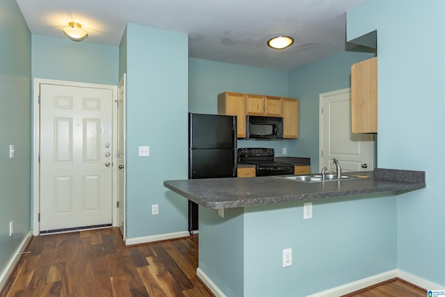 401 20th St S Unit 322, Birmingham, AL 35233 - kitchen featuring black appliances, a sink, dark countertops, a peninsula, and light brown cabinets