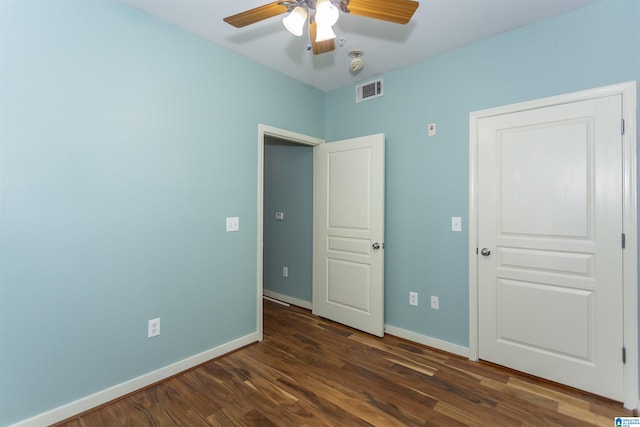 401 20th St S Unit 322, Birmingham, AL 35233 - unfurnished bedroom featuring dark wood-style floors, baseboards, and ceiling fan