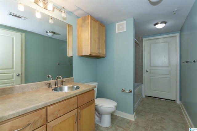 401 20th St S Unit 322, Birmingham, AL 35233 - bathroom featuring vanity, toilet, baseboards, and shower / bathtub combination
