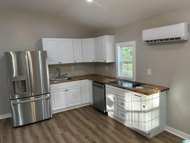 140 County Road 603, Hanceville, AL 35077 - kitchen featuring appliances with stainless steel finishes, a wall unit AC, butcher block countertops, a sink, and lofted ceiling