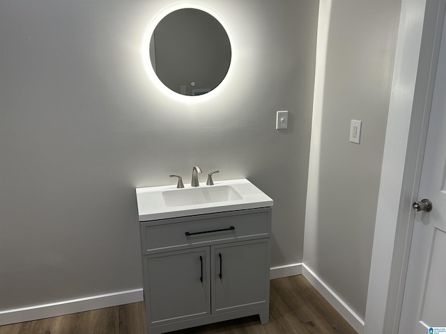 140 County Road 603, Hanceville, AL 35077 - bathroom with wood finished floors, vanity, and baseboards