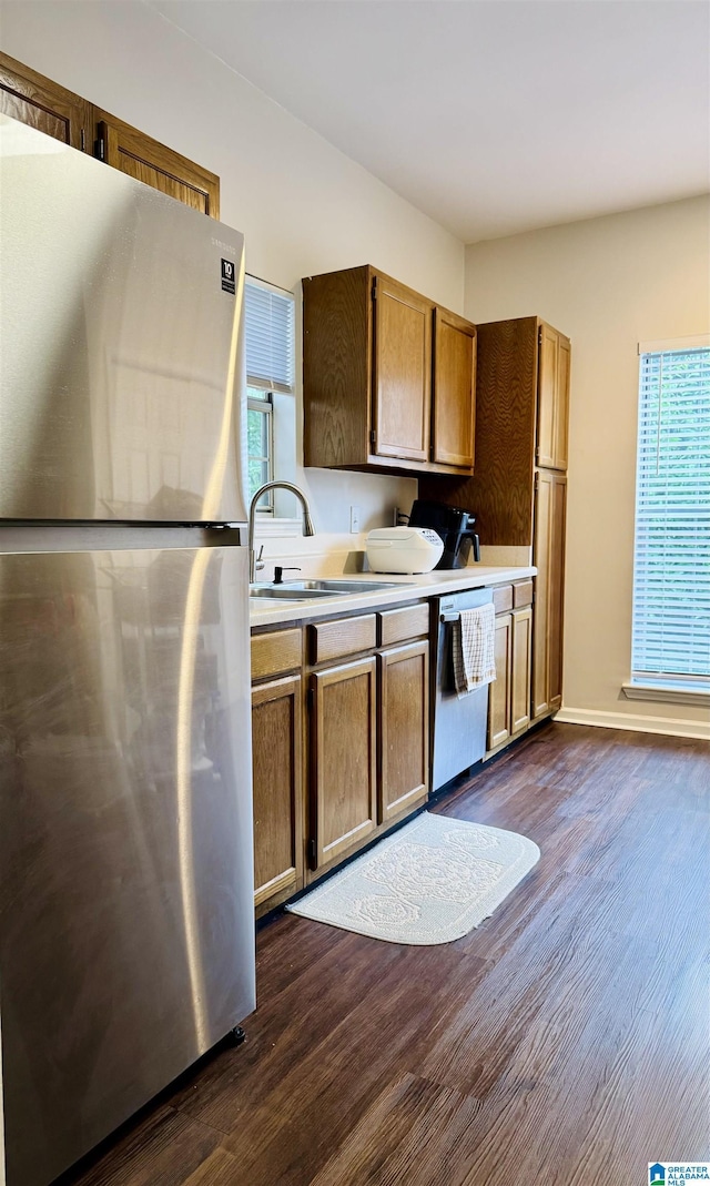 2004 Waterford Pl Unit 2004, Hoover, AL 35244 - kitchen with appliances with stainless steel finishes, healthy amount of natural light, dark wood finished floors, and light countertops