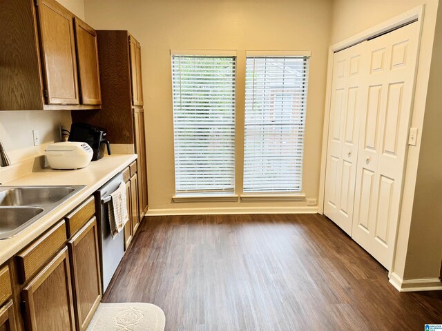 2004 Waterford Pl Unit 2004, Hoover, AL 35244 - kitchen with dishwasher, dark wood finished floors, brown cabinetry, and light countertops