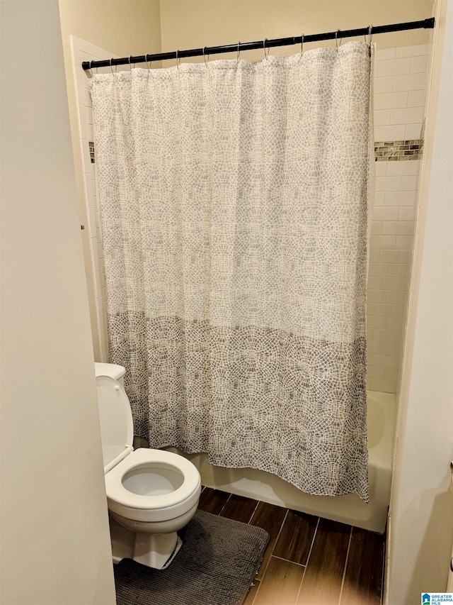 2004 Waterford Pl Unit 2004, Hoover, AL 35244 - full bathroom with wood finished floors and shower / bathtub combination with curtain