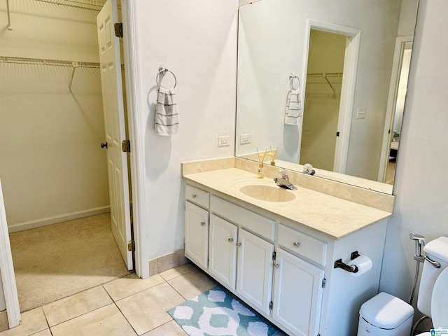2004 Waterford Pl Unit 2004, Hoover, AL 35244 - bathroom with vanity, a spacious closet, and tile patterned floors