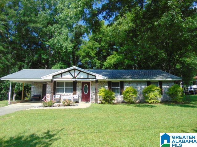 101 Randall Cir, Clanton, AL 35045 - ranch-style home featuring a front lawn, a carport, and concrete driveway