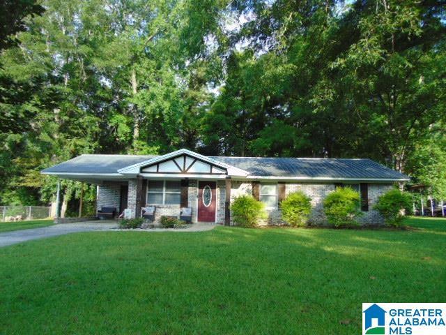 101 Randall Cir, Clanton, AL 35045 - single story home with a front lawn, a carport, and driveway