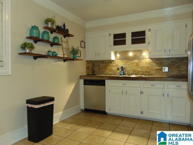 101 Randall Cir, Clanton, AL 35045 - kitchen featuring dishwasher, white cabinetry, tasteful backsplash, dark countertops, and ornamental molding