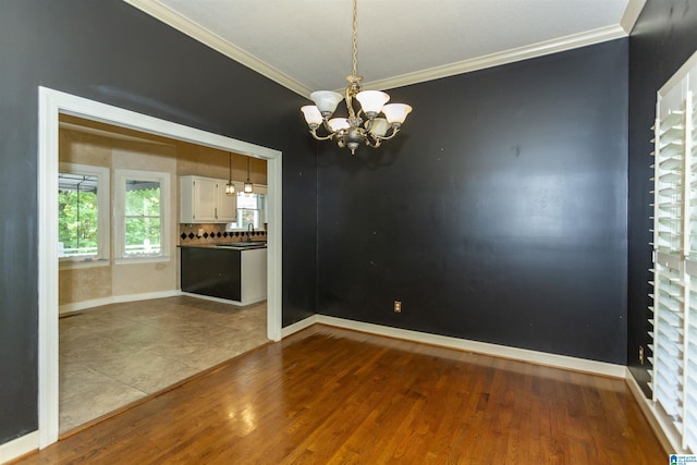 2940 Coatbridge Ln, Birmingham, AL 35242 - unfurnished room featuring crown molding, a chandelier, wood finished floors, and baseboards